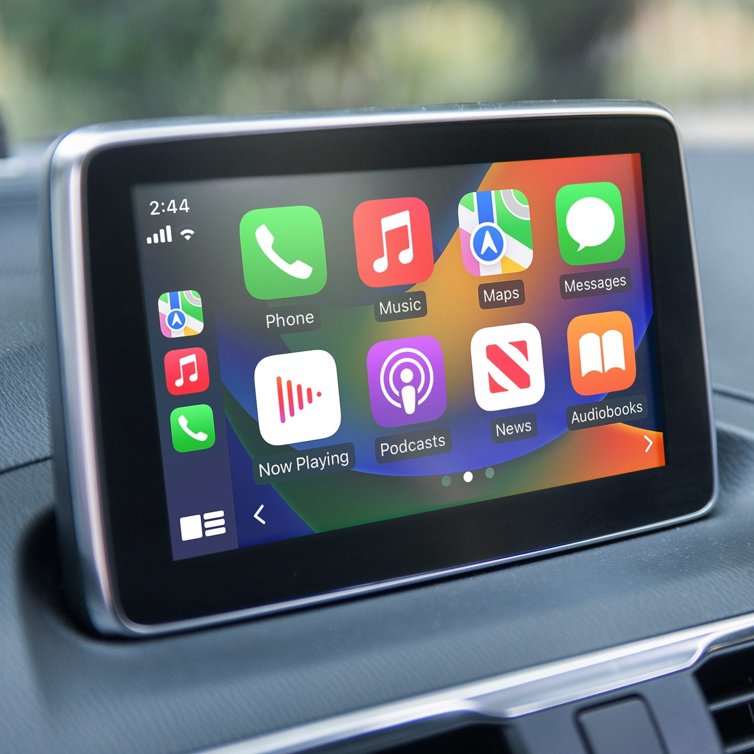 Car infotainment system with app icons displayed on a dashboard